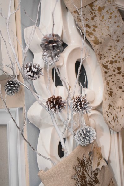 A winter Stocking stuffer decor using dried tree limbs,pine combs and 100%crystals ornaments