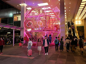 Lunar New Year pig head sculpture lighted up at night at Harbour City