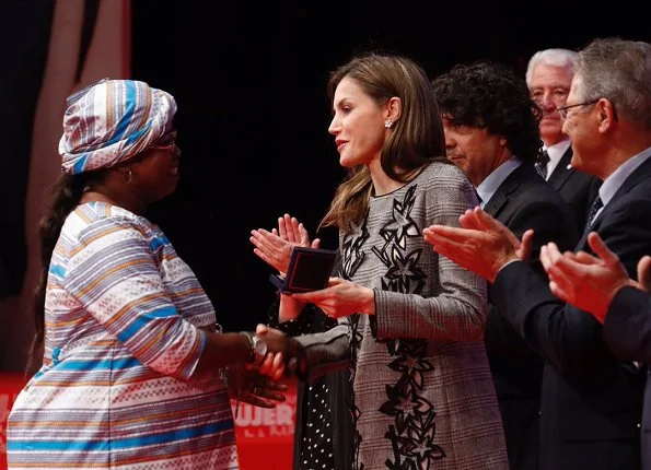Queen Letizia wore Carolina Herrera Prince Of Wales Floral Cutout Dress. Letizia wore Magrit pumps at Red Cross Day event