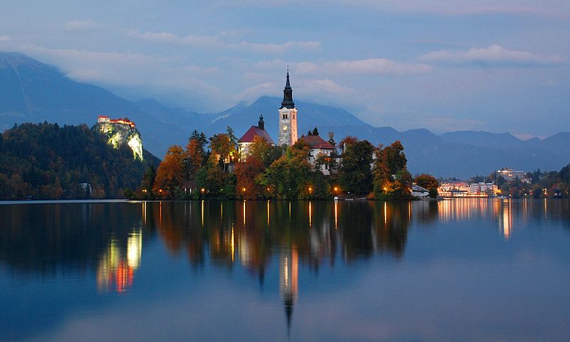 It's twilight on Lake Bled's only island - the Church of the Assumption rises in the center. Photo: WikiMedia.org.