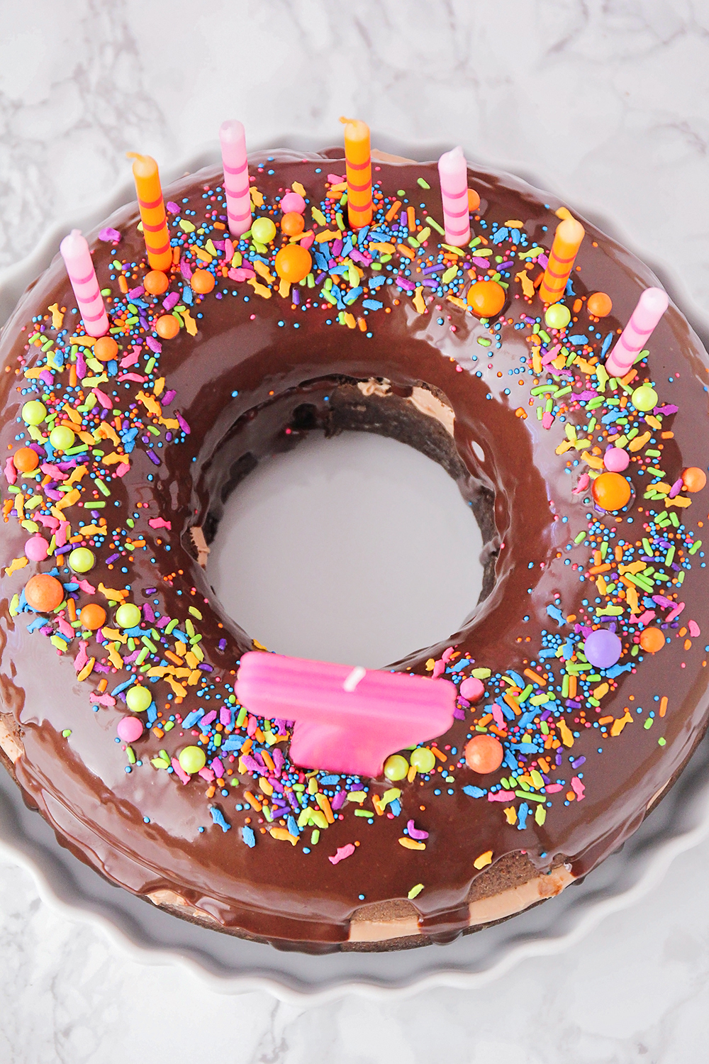 This fun and whimsical chocolate donut birthday cake is so delicious and indulgent!