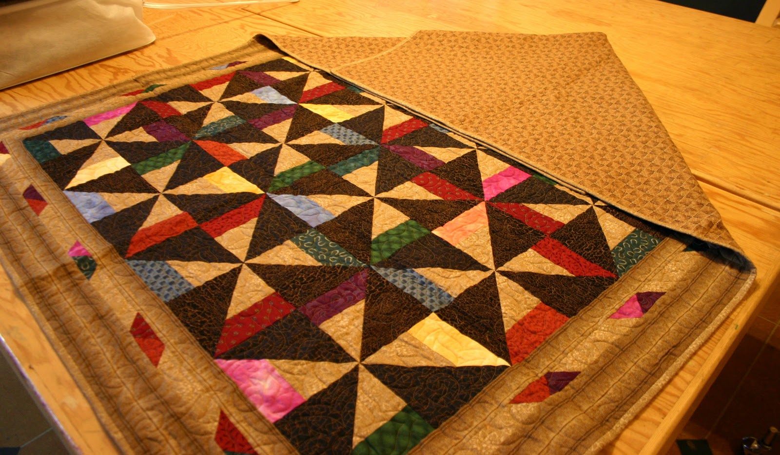Today in Kenogami Folding a Quilt for Storage