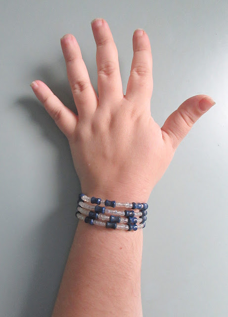 Sciart mathart bracelet featuring the digits of pi in glass and lapis lazuli. Perfect gift for math teachers and students.