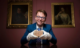 Mathematician Dr Daniel Mansfield with the Plimpton 322 tablet. Photograph: UNSW/Andrew Kelly.