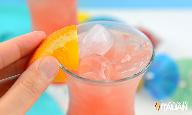 tropical cocktail with orange garnish