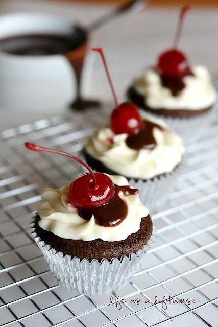 Hot Fudge Sundae Cupcakes are chocolate cupcakes topped with buttercream frosting, homemade hot fudge and a cherry. Life-in-the-Lofthouse.com