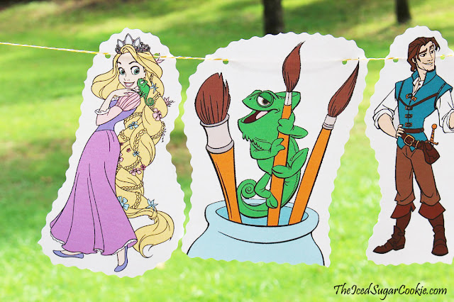 DIY Tangled Birthday Party Rapunzel Flag Hanging Banner Ideas- Pascal Lizard, Flynn Rider, Maximus Horse, Mother Gothel by The Iced Sugar Cookie