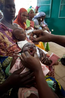 Baby given oral polio vaccine in West Africa