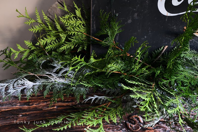 Coca Cola inspired Christmas fireplace mantel decorating with stars - via : https://www.funkyjunkinteriors.net/ Coca Cola inspired Christmas fireplace mantel decorating with stars - via : https://www.funkyjunkinteriors.net/