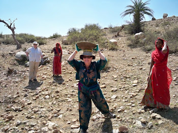 INDIA 2011: DWC Participant carrying  work materials on her head