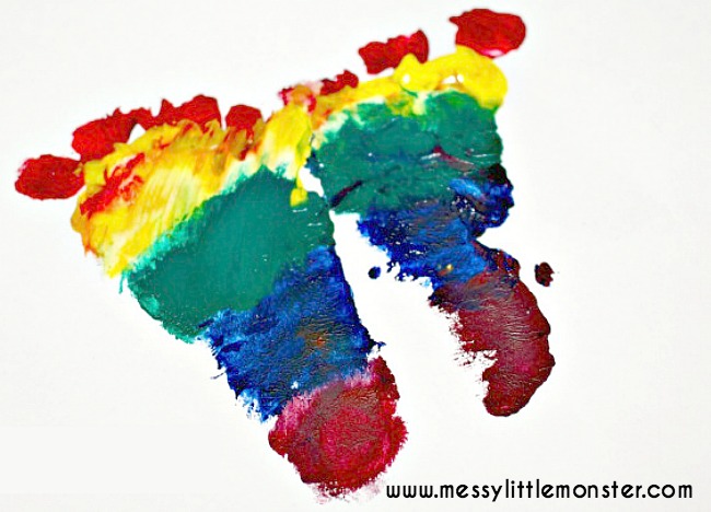 Rainbow footprint craft for kids. A simple butterfly craft for spring. Rainbow footprint craft for kids. A simple butterfly craft for spring.