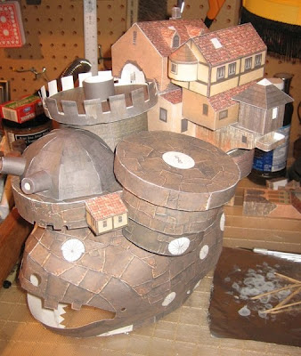 This is a half complete papercraft model of Howl's Moving Castle.