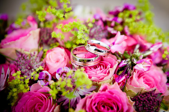wedding rings and flowers 