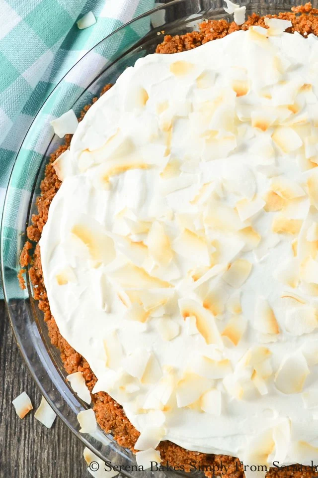 Coconut Pudding Cheesecake covered with toasted coconut is a favorite dessert recipe from Serena Bakes Simply From Scratch.