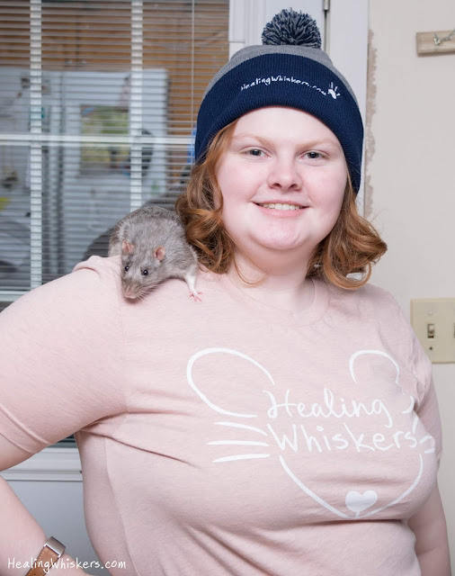 Xavier and Lily Chesnut with Healing Whiskers shirts and beanies