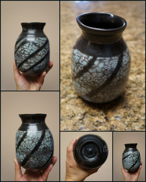 Naked raku pottery - nice result, a turquoise vase with black stripe pattern.