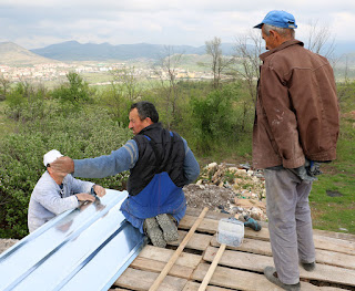 Three men discussing how to do a job Three men discussing how to do a job