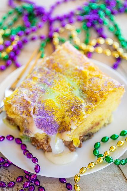 King Cake Earthquake Cake - perfect ending to your Mardi Gras party!! Yellow Cake with pecans and cream cheese. YUM! Cake mix, pecans, cream cheese, butter, powdered sugar, vanilla. Top the cake with a quick glaze and colored sugar. A fun twist on King Cake! Great for dessert or breakfast! #cake #dessert #mardigras #kingcake King Cake Earthquake Cake - perfect ending to your Mardi Gras party!! Yellow Cake with pecans and cream cheese. YUM! Cake mix, pecans, cream cheese, butter, powdered sugar, vanilla. Top the cake with a quick glaze and colored sugar. A fun twist on King Cake! Great for dessert or breakfast! #cake #dessert #mardigras #kingcake