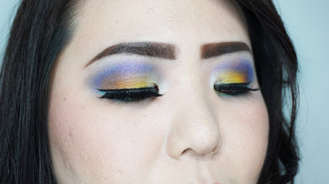 A tutorial for Colorful summer inspired makeup look. Purple, blue and yellow eye look for summer photoshoot. MUA: Theresia feegy