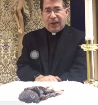 catholic priest dead baby altar