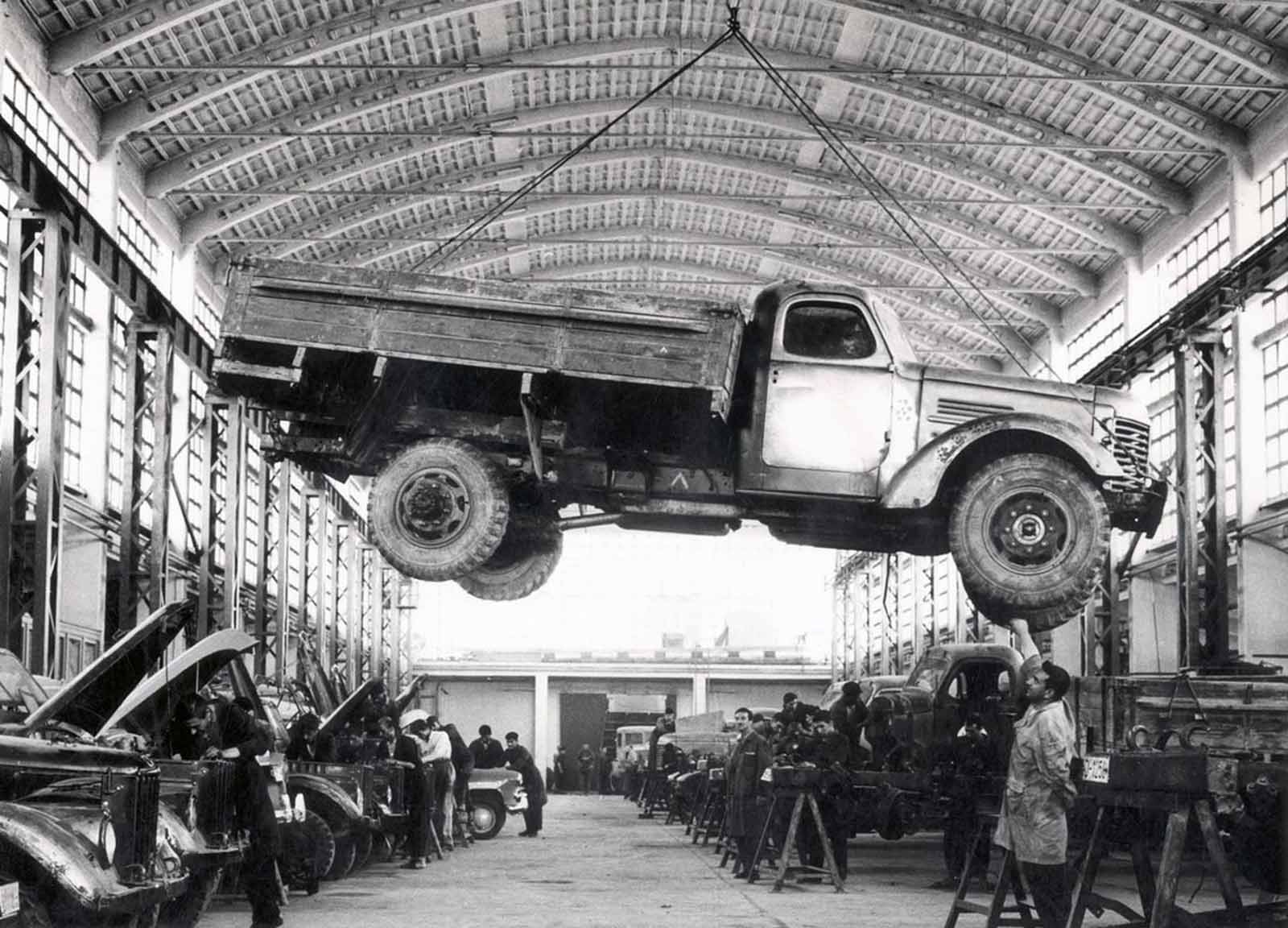 An Afghan worker checks a Russian-made truck in the Kabul Janagalak factory in an unspecified date. The factory situated in the center of the city as the only firm for making vehicle's chassis was plundered, like other public properties in the Afghan capital, during the Afghan mujahedin rule from 1992 to 1996.