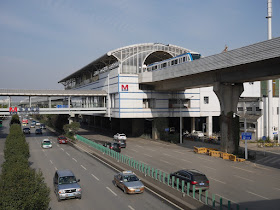 view of Toudao Street Station (头道街站) in Wuhan with a departing metro train