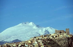 Motta Sant'Anastasia, with a snow-covered Mount  Etna in the background