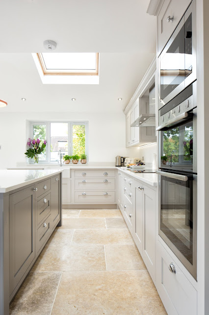 white and grey shaker kitchen with island and white walls