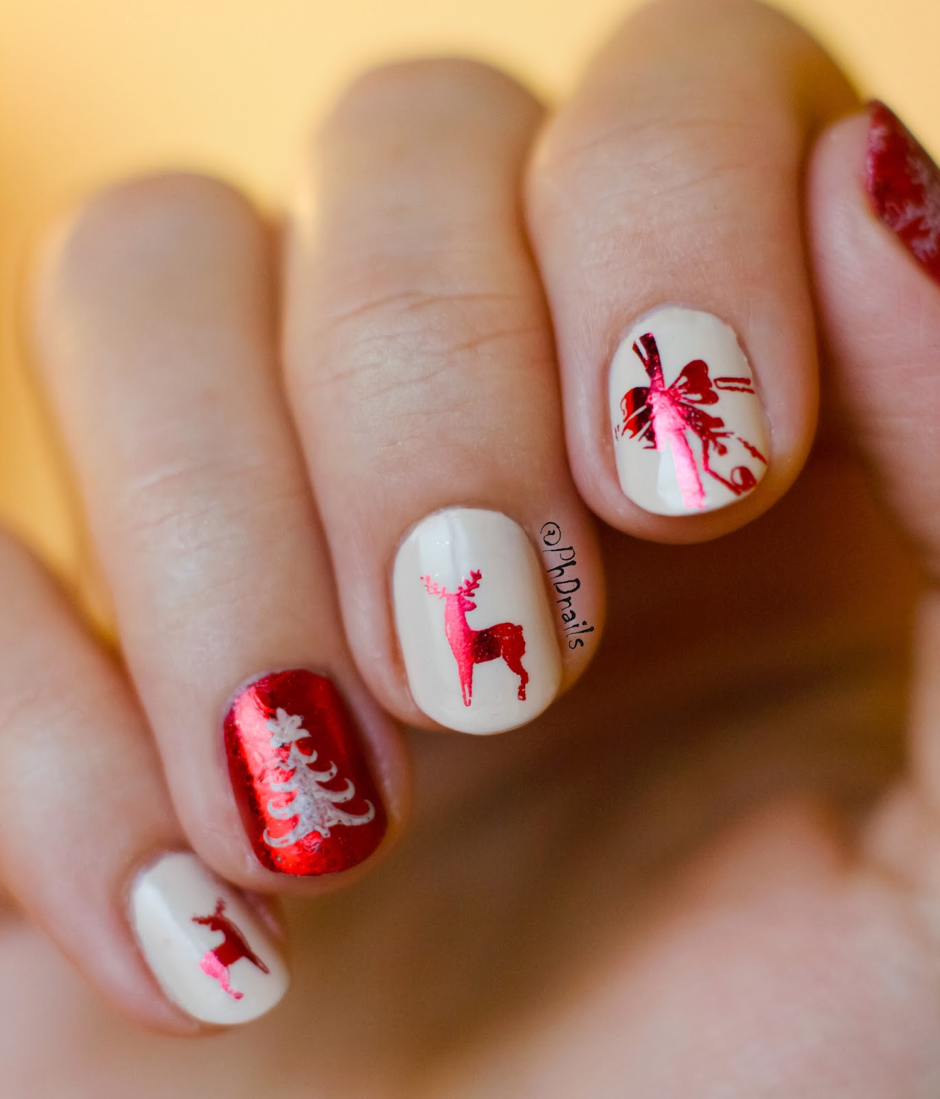 PhD nails: Reindeer wrapping paper inspired nail art with foil stamping