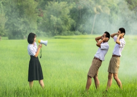 A woman speaking using a loudspeaker. A woman speaking using a loudspeaker.
