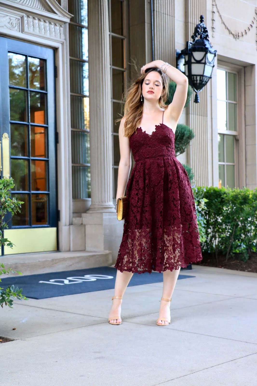 Nyc fashion blogger Kathleen Harper wearing a lace burgundy dress