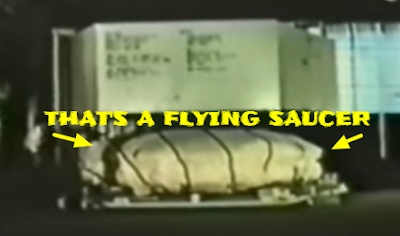 Flying Saucer under a cover been transported in a box. Flying Saucer under a cover been transported in a box.