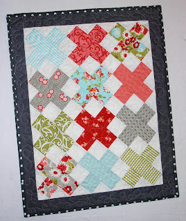 "Mini 'X' Quilt Top" is a Free Modern Mini Quilt Pattern designed by Debbie from A Quilter's Table!
