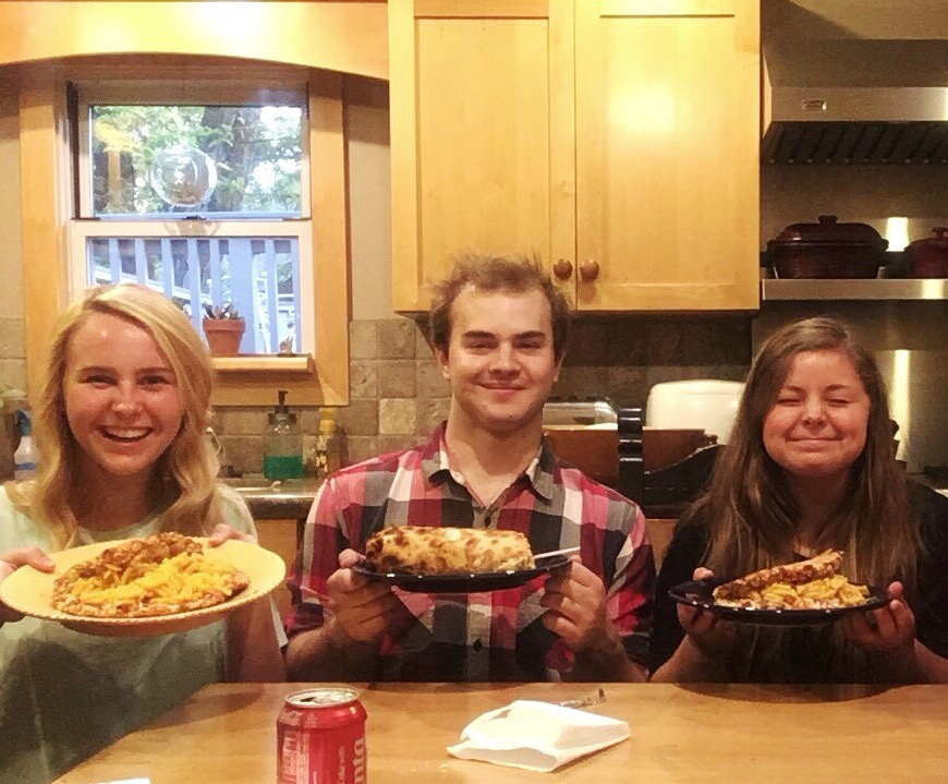group of friends eating tortino's pizza and kraft mac n cheese friends eating pizza with mac n cheese