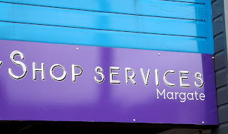 Purple fascia, with vinyl letters placed over the top.