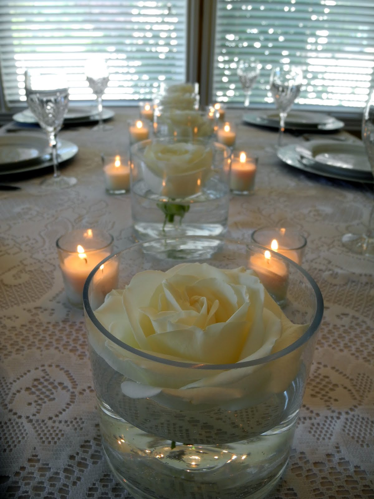 The Flower Girl Blog floating roses an elegant white wedding