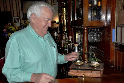 owner Stephen Willey with gold scale at National Hotel in Jamestown, California