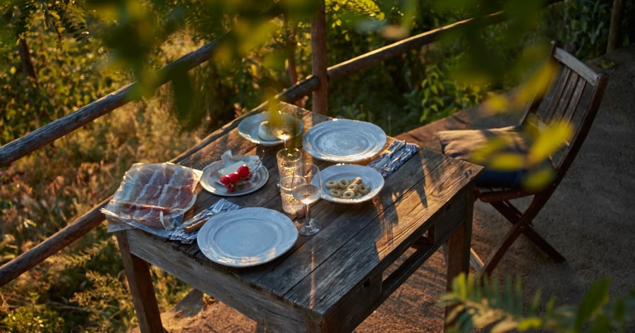 A rustic kitchen and favorite table under the fig tree