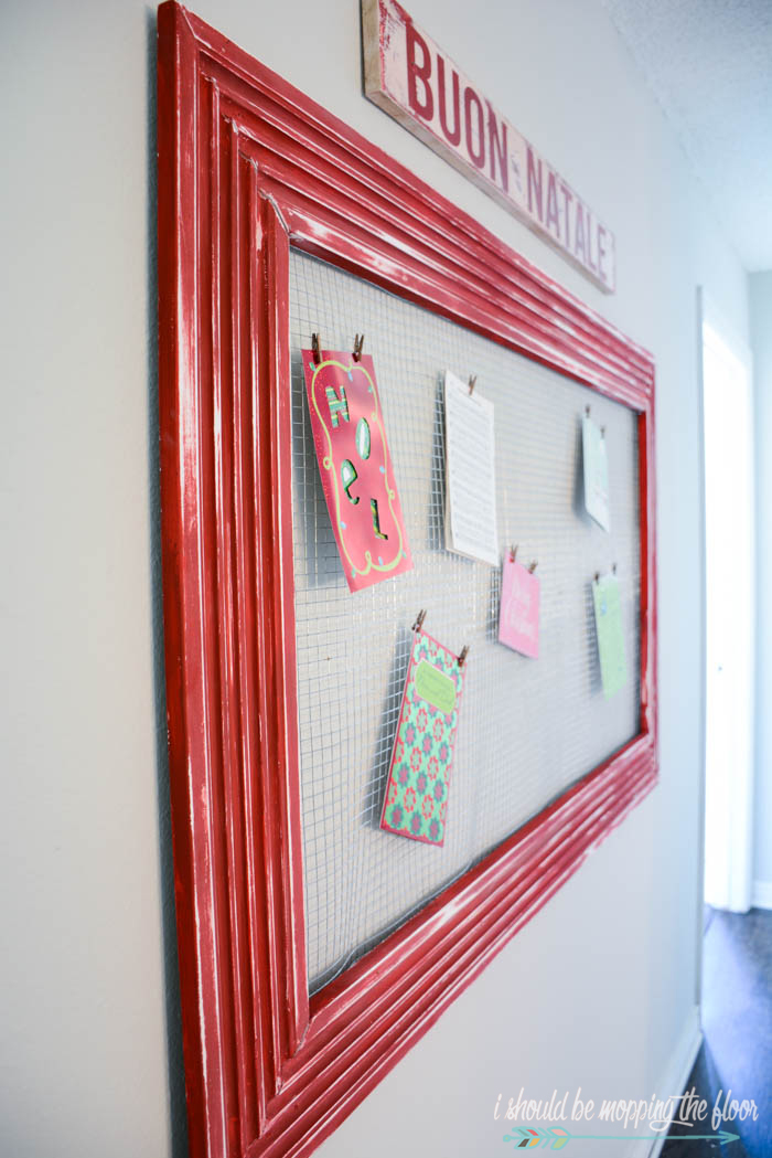 DIY Christmas Card Holder | Put together this oversized holiday card display with moulding and L brackets (and mesh!). Check out the entire tutorial.