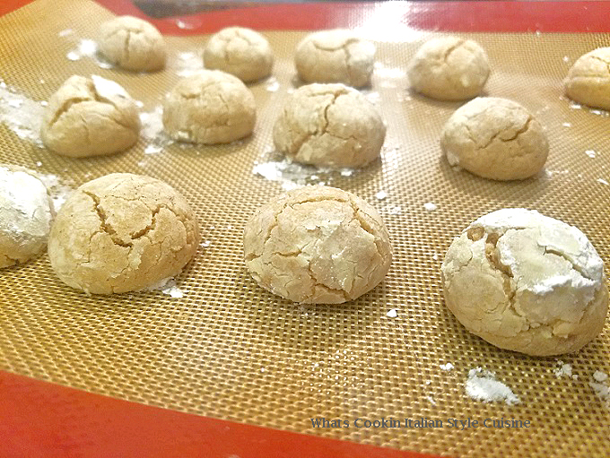 these are three crinkle cookies made with cinnamon flavors and buttery cookies rolled in powdered sugar with crinkles on top