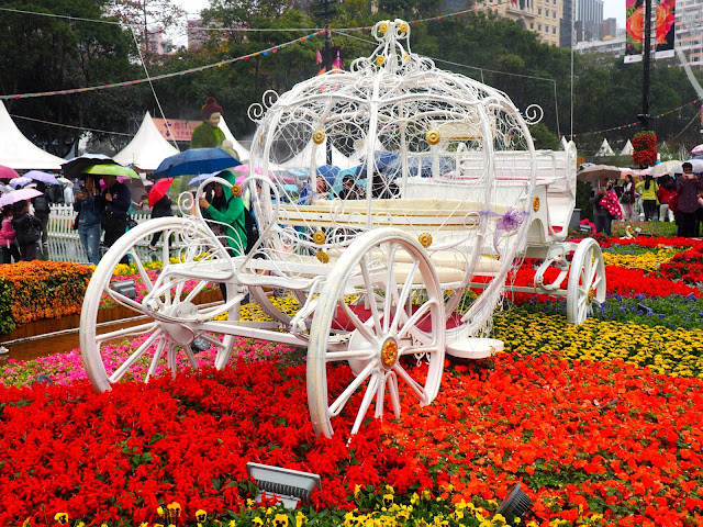 White carriage in a flower bed at Hong Kong Flower Festival 2017
