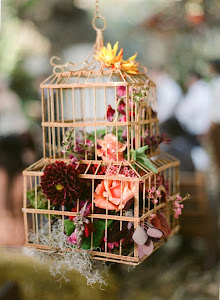 Our birdcage with flowers used in a wedding
