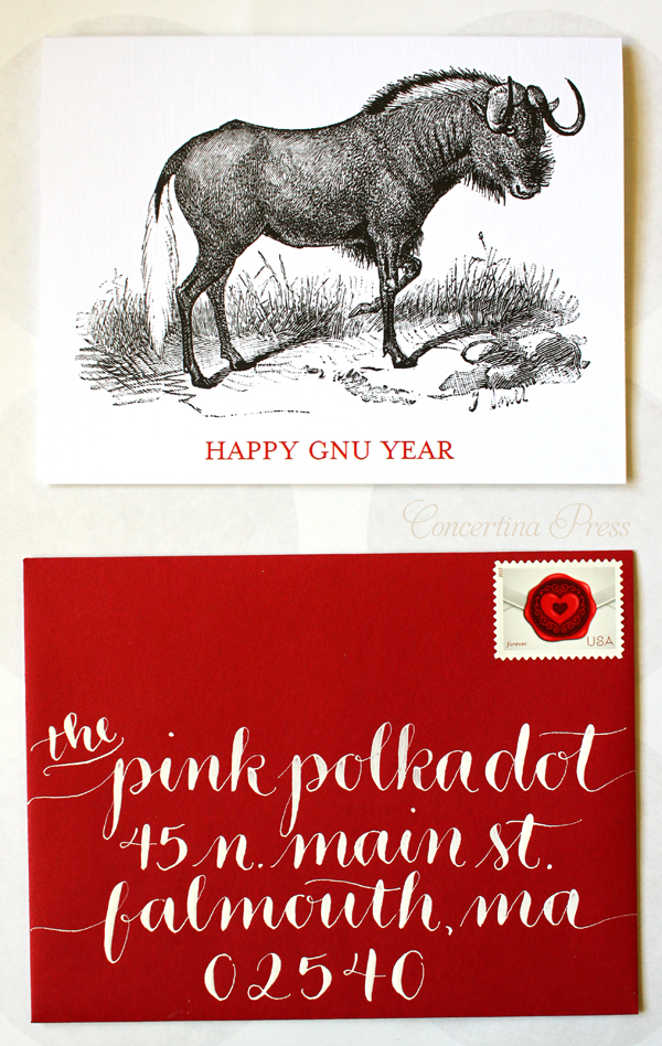 Cape Cod wedding blog photo from Concertina Press - Stationery and Invitations about Gorgeous Christmas Card Calligraphy White Ink on Red Envelopes