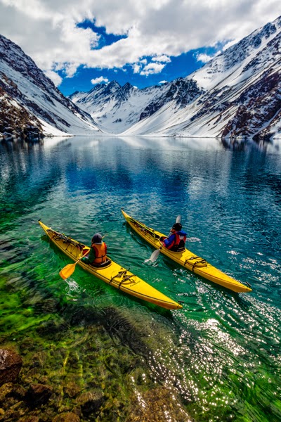 10 Best Adventure Holiday Destinations | James Heim and Michelle Parker using Kayaks to access skiing on Laguna de Incas in Portillo Chile 10 Best Adventure Holiday Destinations | James Heim and Michelle Parker using Kayaks to access skiing on Laguna de Incas in Portillo Chile