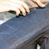 Denim Garments Hand Scraping and Sand Blasting During Washing