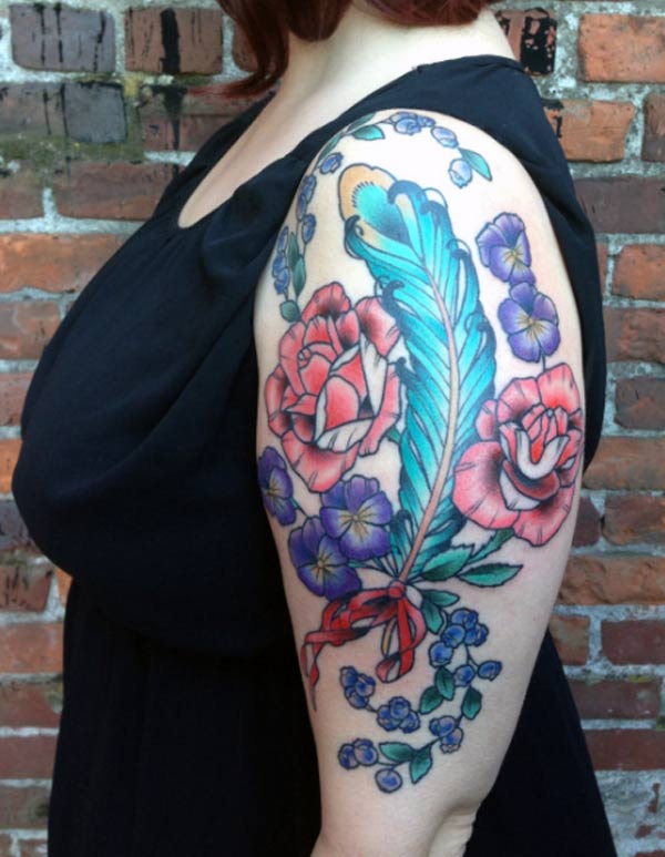 That's so amazing and gorgeous rose and periwinkle flowers around the feather stunning colorful tattoo designs That's so amazing and gorgeous rose and periwinkle flowers around the feather stunning colorful tattoo designs