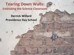 half of a brick wall with the saying:tearing down walls extending the science classroom