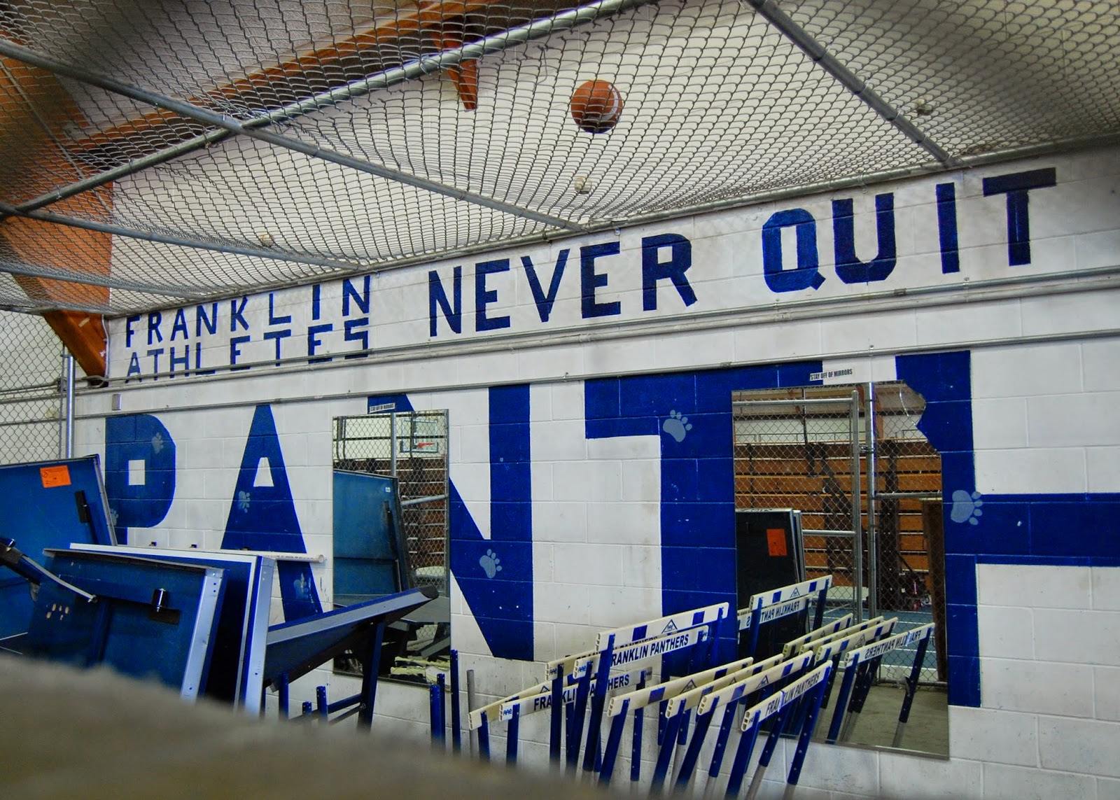 inside the field house 'cage' - "Franklin Athletes Never Quit"