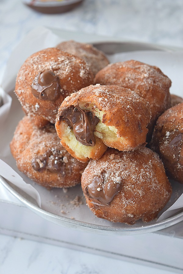 Amazing Cinnamon Sugar Donuts stuffed/ filled with Nutella is such a great treat for Breakfast / Dessert that you will keep going for seconds!