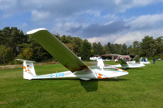 Gliders at Hayingen airfield. Infrastructure of the club in the background